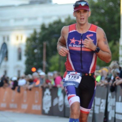 Wes running to the finish line at Ironman Wisconsin, 2016.